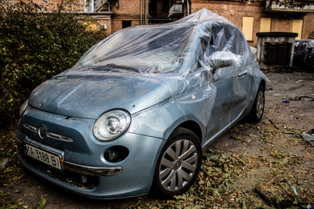 Aftermath of massive Russian missile attacks, cars around the Samsung office building was hit hard. The damage to the vehicles is considerable and several of them are destroyed.のeditorial素材