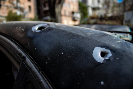 Aftermath of massive Russian missile attacks, cars around the Samsung office building was hit hard. The damage to the vehicles is considerable and several of them are destroyed.のeditorial素材
