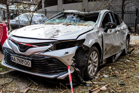 Aftermath of massive Russian missile attacks, cars around the Samsung office building was hit hard. The damage to the vehicles is considerable and several of them are destroyed.のeditorial素材
