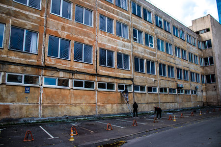 Aftermath of massive Russian missile attacks, debris littering the ground around the Samsung office building. The blast from the explosion sent shards of glass and metal in all directions causing extensive secondary damage, many people were seriously injuのeditorial素材