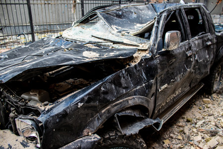 Aftermath of massive Russian missile attacks, cars around the Samsung office building was hit hard. The damage to the vehicles is considerable and several of them are destroyed.のeditorial素材