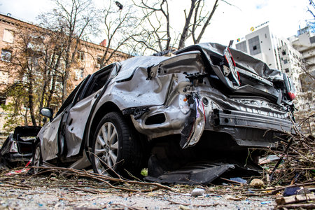 Aftermath of massive Russian missile attacks, cars around the Samsung office building was hit hard. The damage to the vehicles is considerable and several of them are destroyed.のeditorial素材