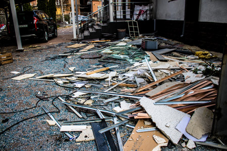 Aftermath of massive Russian missile attacks, debris littering the ground around the Samsung office building. The blast from the explosion sent shards of glass and metal in all directions causing extensive secondary damage, many people were seriously injuのeditorial素材