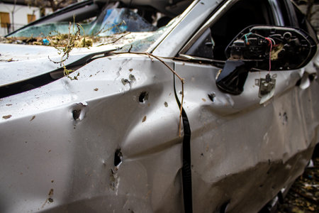 Aftermath of massive Russian missile attacks, cars around the Samsung office building was hit hard. The damage to the vehicles is considerable and several of them are destroyed.のeditorial素材