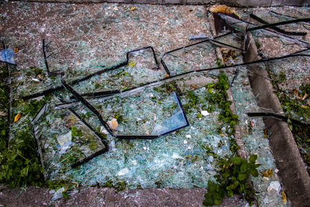 Aftermath of massive Russian missile attacks, debris littering the ground around the Samsung office building. The blast from the explosion sent shards of glass and metal in all directions causing extensive secondary damage, many people were seriously injuのeditorial素材