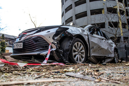 Aftermath of massive Russian missile attacks, cars around the Samsung office building was hit hard. The damage to the vehicles is considerable and several of them are destroyed.のeditorial素材