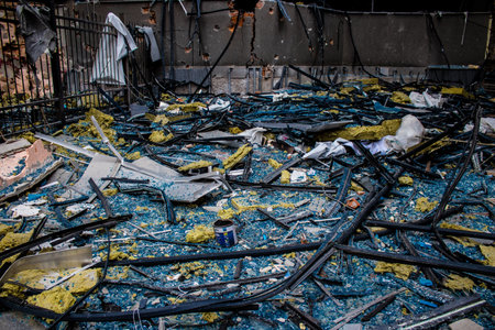 Aftermath of massive Russian missile attacks, debris littering the ground around the Samsung office building. The blast from the explosion sent shards of glass and metal in all directions causing extensive secondary damage, many people were seriously injuのeditorial素材