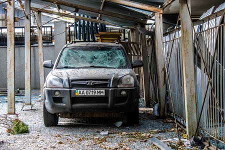 Aftermath of massive Russian missile attacks, cars around the Samsung office building was hit hard. The damage to the vehicles is considerable and several of them are destroyed.のeditorial素材