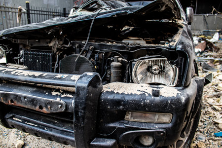 Aftermath of massive Russian missile attacks, cars around the Samsung office building was hit hard. The damage to the vehicles is considerable and several of them are destroyed.のeditorial素材