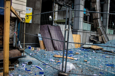 Aftermath of massive Russian missile attacks, debris littering the ground around the Samsung office building. The blast from the explosion sent shards of glass and metal in all directions causing extensive secondary damage, many people were seriously injuのeditorial素材