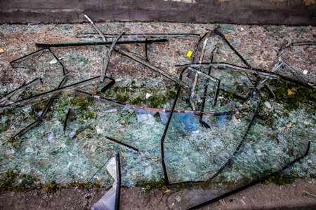 Aftermath of massive Russian missile attacks, debris littering the ground around the Samsung office building. The blast from the explosion sent shards of glass and metal in all directions causing extensive secondary damage, many people were seriously injuのeditorial素材