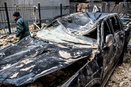 Aftermath of massive Russian missile attacks, cars around the Samsung office building was hit hard. The damage to the vehicles is considerable and several of them are destroyed.のeditorial素材