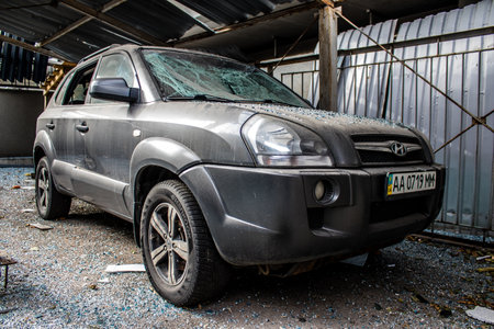 Aftermath of massive Russian missile attacks, cars around the Samsung office building was hit hard. The damage to the vehicles is considerable and several of them are destroyed.のeditorial素材
