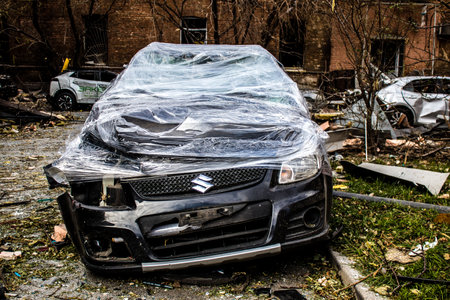Aftermath of massive Russian missile attacks, cars around the Samsung office building was hit hard. The damage to the vehicles is considerable and several of them are destroyed.のeditorial素材