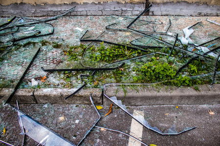 Aftermath of massive Russian missile attacks, debris littering the ground around the Samsung office building. The blast from the explosion sent shards of glass and metal in all directions causing extensive secondary damage, many people were seriously injuのeditorial素材