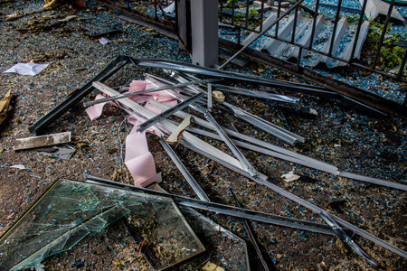 Aftermath of massive Russian missile attacks, debris littering the ground around the Samsung office building. The blast from the explosion sent shards of glass and metal in all directions causing extensive secondary damage, many people were seriously injuのeditorial素材