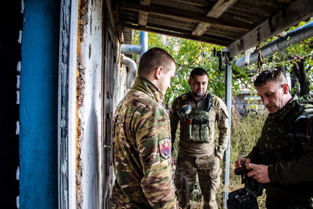 Soldiers have a resting time and enjoy before the attack, Ukrainian army infantry soldiers on the front line, they specialize in mortar fire from enemy lines. Their objective is to weaken the Russian army by permanent fire, their situation is very dangeroのeditorial素材