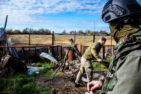 Ukrainian army infantry soldiers on the front line, they specialize in mortar fire from enemy lines. Their objective is to weaken the Russian army by permanent fire, their situation is very dangerous because the Russians retaliate quicklyのeditorial素材