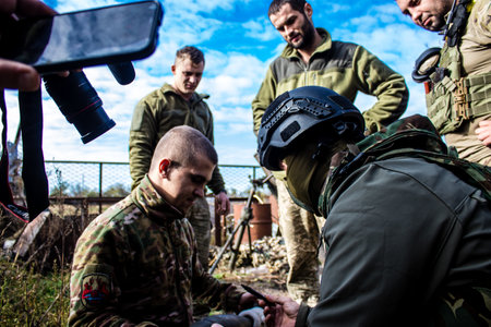 Ukrainian army infantry soldiers on the front line, they specialize in mortar fire from enemy lines. Their objective is to weaken the Russian army by permanent fire, their situation is very dangerous because the Russians retaliate quicklyのeditorial素材