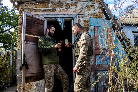 Soldiers have a resting time and enjoy before the attack, Ukrainian army infantry soldiers on the front line, they specialize in mortar fire from enemy lines. Their objective is to weaken the Russian army by permanent fire, their situation is very dangeroのeditorial素材