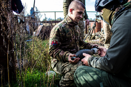 Ukrainian army infantry soldiers on the front line, they specialize in mortar fire from enemy lines. Their objective is to weaken the Russian army by permanent fire, their situation is very dangerous because the Russians retaliate quicklyのeditorial素材