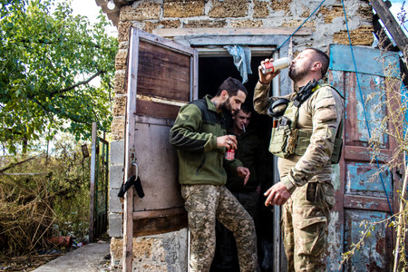 Soldiers have a resting time and enjoy before the attack, Ukrainian army infantry soldiers on the front line, they specialize in mortar fire from enemy lines. Their objective is to weaken the Russian army by permanent fire, their situation is very dangeroのeditorial素材