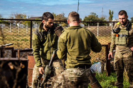 Ukrainian army infantry soldiers on the front line, they specialize in mortar fire from enemy lines. Their objective is to weaken the Russian army by permanent fire, their situation is very dangerous because the Russians retaliate quicklyのeditorial素材