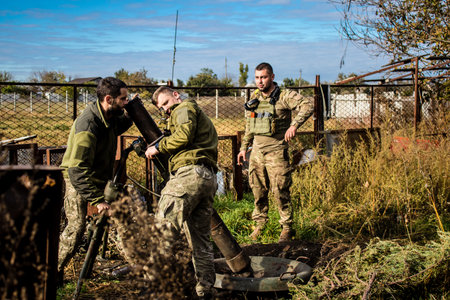 Ukrainian army infantry soldiers on the front line, they specialize in mortar fire from enemy lines. Their objective is to weaken the Russian army by permanent fire, their situation is very dangerous because the Russians retaliate quicklyのeditorial素材