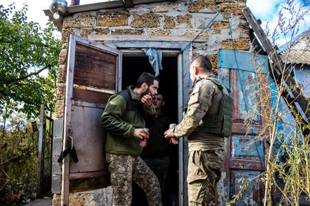 Soldiers have a resting time and enjoy before the attack, Ukrainian army infantry soldiers on the front line, they specialize in mortar fire from enemy lines. Their objective is to weaken the Russian army by permanent fire, their situation is very dangeroのeditorial素材