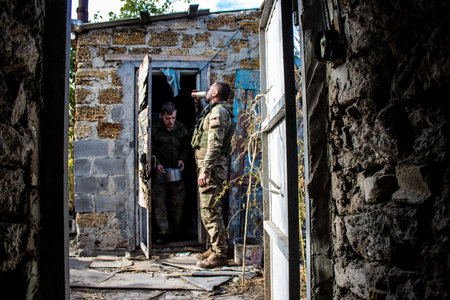 Soldiers have a resting time and enjoy before the attack, Ukrainian army infantry soldiers on the front line, they specialize in mortar fire from enemy lines. Their objective is to weaken the Russian army by permanent fire, their situation is very dangeroのeditorial素材