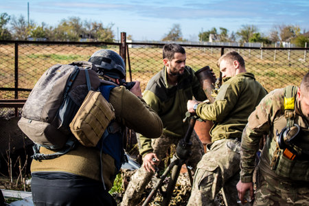 Ukrainian army infantry soldiers on the front line, they specialize in mortar fire from enemy lines. Their objective is to weaken the Russian army by permanent fire, their situation is very dangerous because the Russians retaliate quicklyのeditorial素材