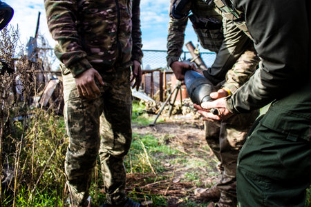 Ukrainian army infantry soldiers on the front line, they specialize in mortar fire from enemy lines. Their objective is to weaken the Russian army by permanent fire, their situation is very dangerous because the Russians retaliate quicklyのeditorial素材