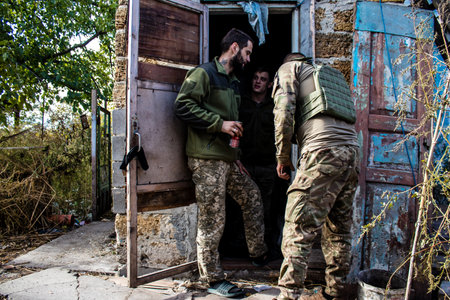 Soldiers have a resting time and enjoy before the attack, Ukrainian army infantry soldiers on the front line, they specialize in mortar fire from enemy lines. Their objective is to weaken the Russian army by permanent fire, their situation is very dangeroのeditorial素材