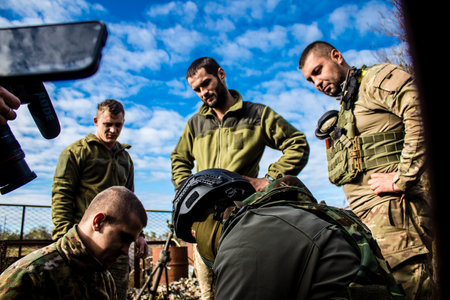 Ukrainian army infantry soldiers on the front line, they specialize in mortar fire from enemy lines. Their objective is to weaken the Russian army by permanent fire, their situation is very dangerous because the Russians retaliate quicklyのeditorial素材