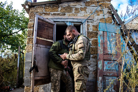 Soldiers have a resting time and enjoy before the attack, Ukrainian army infantry soldiers on the front line, they specialize in mortar fire from enemy lines. Their objective is to weaken the Russian army by permanent fire, their situation is very dangeroのeditorial素材