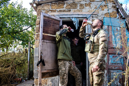 Soldiers have a resting time and enjoy before the attack, Ukrainian army infantry soldiers on the front line, they specialize in mortar fire from enemy lines. Their objective is to weaken the Russian army by permanent fire, their situation is very dangeroのeditorial素材