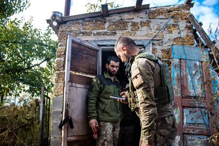 Soldiers have a resting time and enjoy before the attack, Ukrainian army infantry soldiers on the front line, they specialize in mortar fire from enemy lines. Their objective is to weaken the Russian army by permanent fire, their situation is very dangeroのeditorial素材