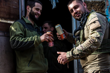 Soldiers have a resting time and enjoy before the attack, Ukrainian army infantry soldiers on the front line, they specialize in mortar fire from enemy lines. Their objective is to weaken the Russian army by permanent fire, their situation is very dangeroのeditorial素材
