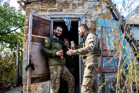Soldiers have a resting time and enjoy before the attack, Ukrainian army infantry soldiers on the front line, they specialize in mortar fire from enemy lines. Their objective is to weaken the Russian army by permanent fire, their situation is very dangeroのeditorial素材