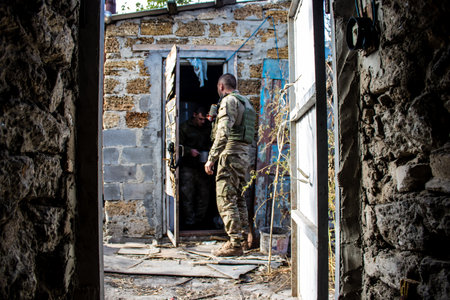 Soldiers have a resting time and enjoy before the attack, Ukrainian army infantry soldiers on the front line, they specialize in mortar fire from enemy lines. Their objective is to weaken the Russian army by permanent fire, their situation is very dangeroのeditorial素材