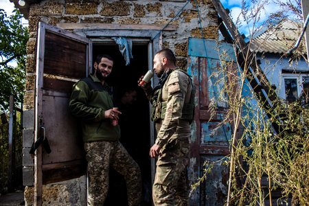 Soldiers have a resting time and enjoy before the attack, Ukrainian army infantry soldiers on the front line, they specialize in mortar fire from enemy lines. Their objective is to weaken the Russian army by permanent fire, their situation is very dangeroのeditorial素材