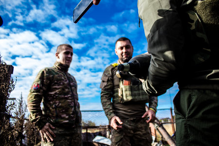 Ukrainian army infantry soldiers on the front line, they specialize in mortar fire from enemy lines. Their objective is to weaken the Russian army by permanent fire, their situation is very dangerous because the Russians retaliate quicklyのeditorial素材