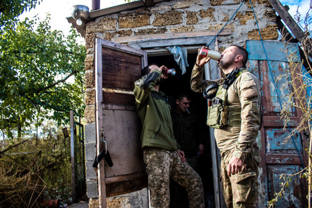 Soldiers have a resting time and enjoy before the attack, Ukrainian army infantry soldiers on the front line, they specialize in mortar fire from enemy lines. Their objective is to weaken the Russian army by permanent fire, their situation is very dangeroのeditorial素材