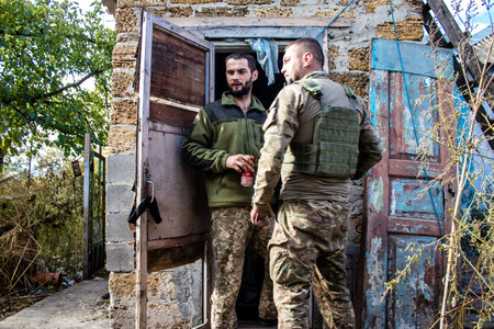 Soldiers have a resting time and enjoy before the attack, Ukrainian army infantry soldiers on the front line, they specialize in mortar fire from enemy lines. Their objective is to weaken the Russian army by permanent fire, their situation is very dangeroのeditorial素材