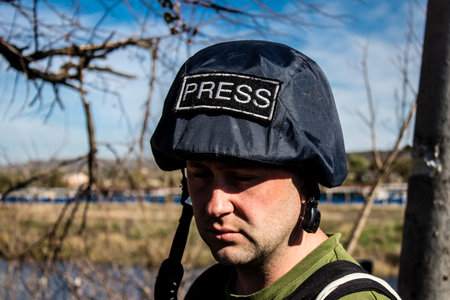 Portrait of Matej Sulc, a famous Slovak television journalist working in a team with Tomas Davidov in the city of Bakhmut, covering the war under the bombardments, this journalist was in the conflict zone and provided direct information on the situation. のeditorial素材