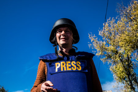 Portrait of Tomas Davidov, a famous Slovak television journalist working in a team with Matej Sulc in the city of Bakhmut, covering the war under the bombardments, this journalist was in the conflict zone and provided direct information on the situation. のeditorial素材