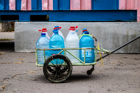 People come to get water between two bombardments. Following the Russian attack on the city of...