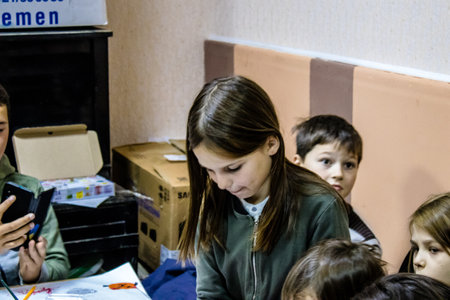 Children from Bakhmut in Ukraine residing at the Dnipro refugee house. Caritas Ukraine provides humanitarian aid and supports communities affected by the long-term impacts of the conflict, including emergency supplies, education and healthcareのeditorial素材