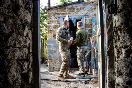 Soldiers have a resting time and enjoy before the attack, Ukrainian army infantry soldiers on the front line, they specialize in mortar fire from enemy lines. Their objective is to weaken the Russian army by permanent fire, their situation is very dangeroのeditorial素材