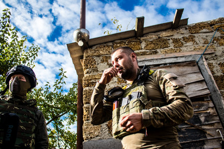 Soldiers have a resting time and enjoy before the attack, Ukrainian army infantry soldiers on the front line, they specialize in mortar fire from enemy lines. Their objective is to weaken the Russian army by permanent fire, their situation is very dangeroのeditorial素材